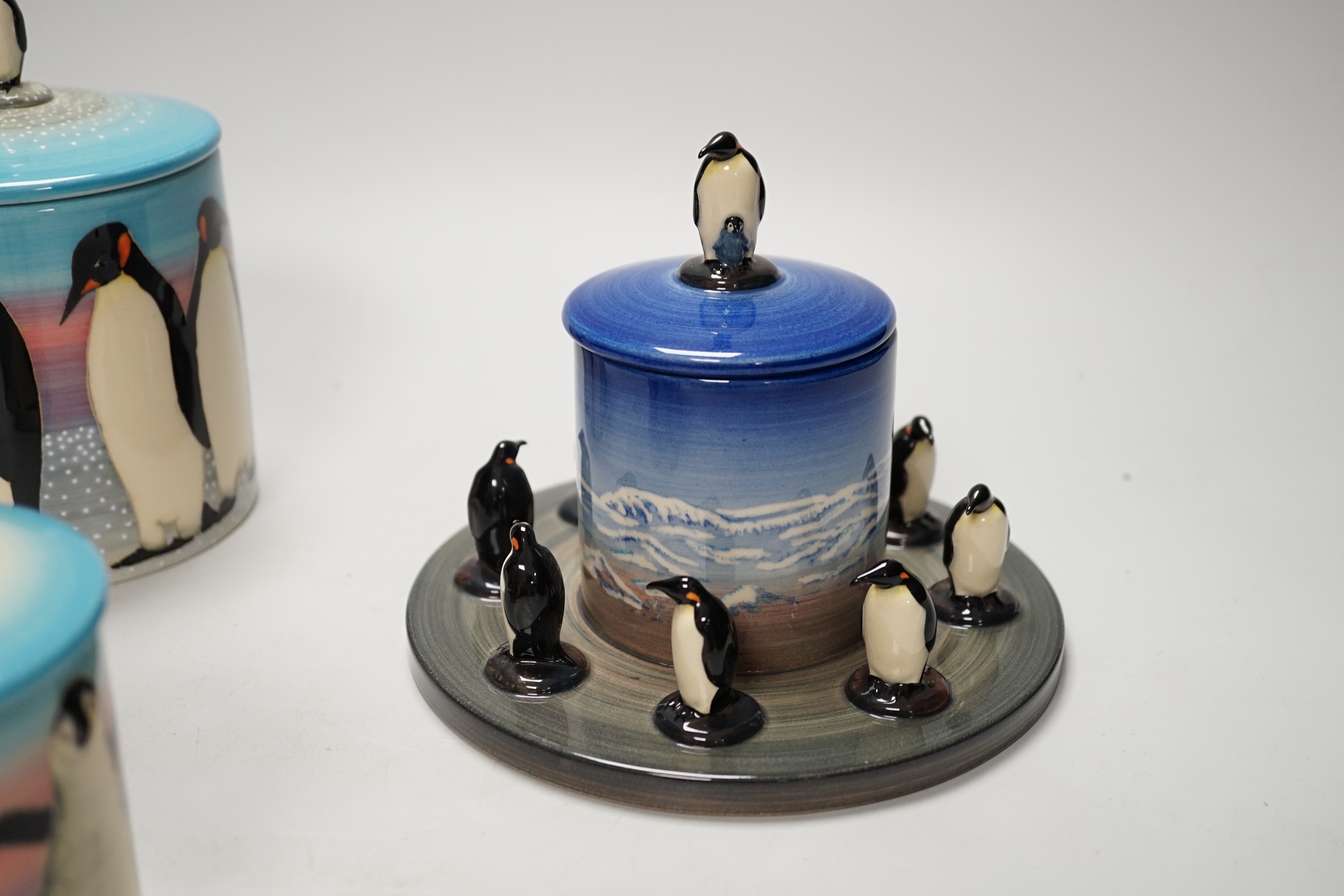 Three Sally Tuffin for Dennis China Works biscuit barrels with penguin knops, the largest 16cm high